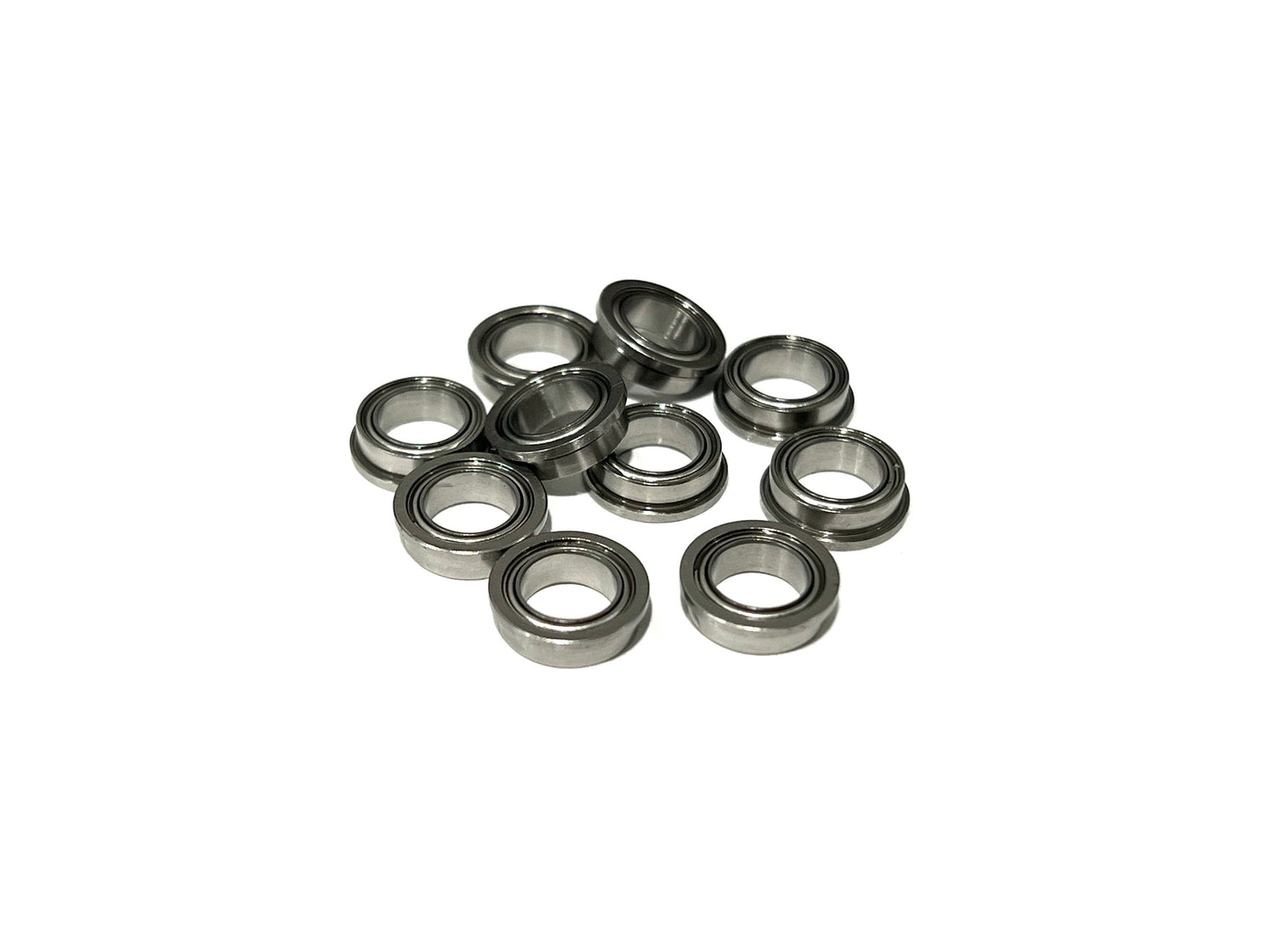 A set of ten flanged ceramic hybrid bearings arranged on a white surface.