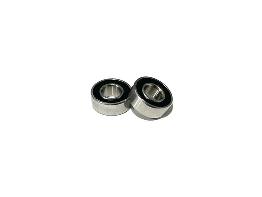 Two Sortafast stainless steel RC bearings in 5x11x4mm with a non-flanged design and black rubber seals, displayed against a white background.