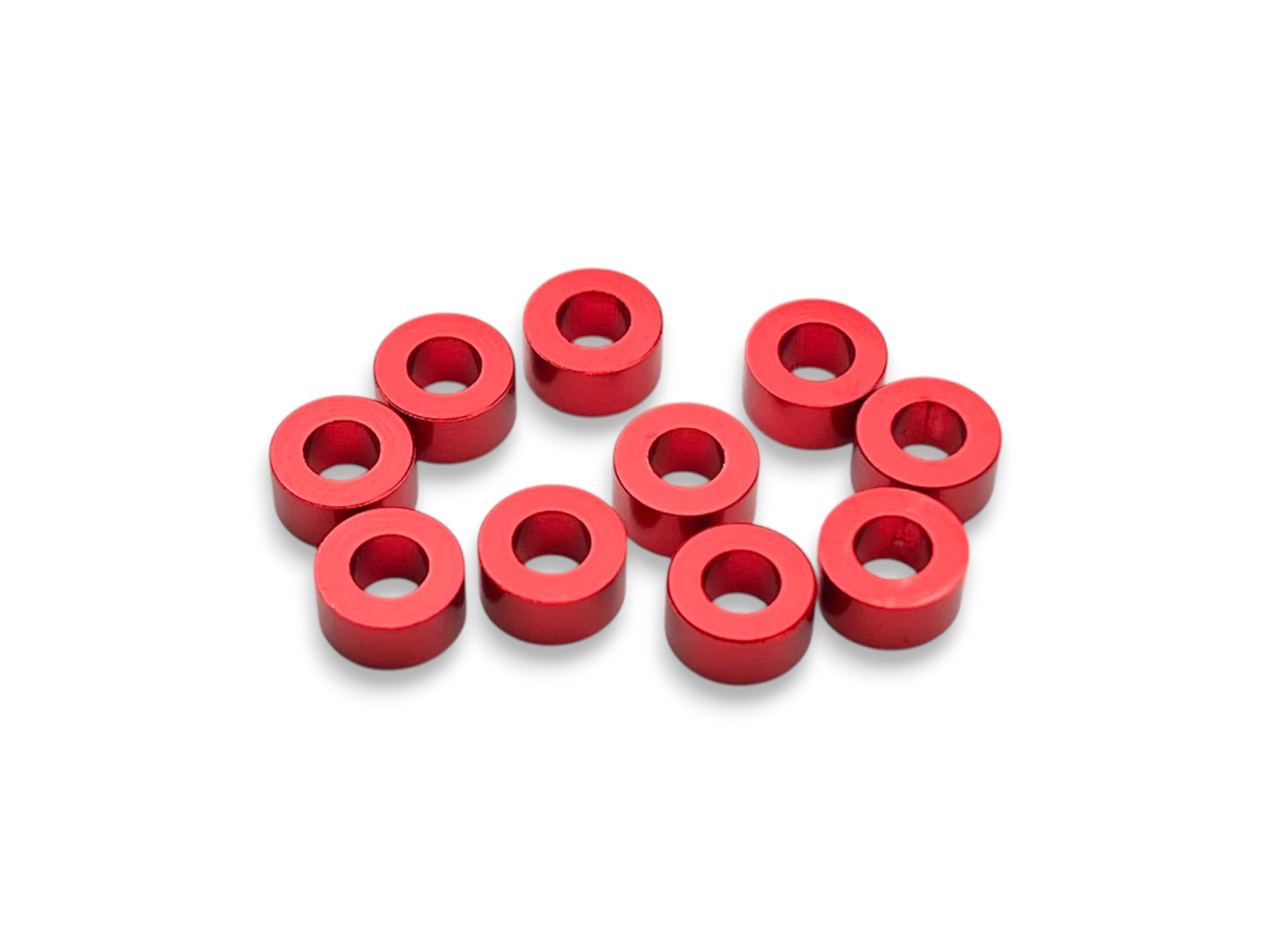 Sortafast 3 × 6 × 3 mm aluminum shims in red anodized finish, 10-piece pack.