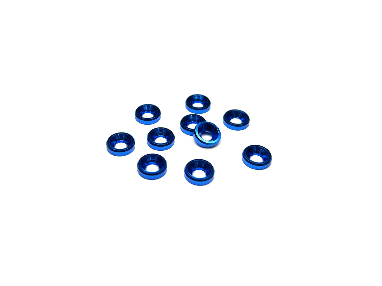 Close-up of 10 blue anodized aluminum countersink washers for M3 screws, arranged on a white background.