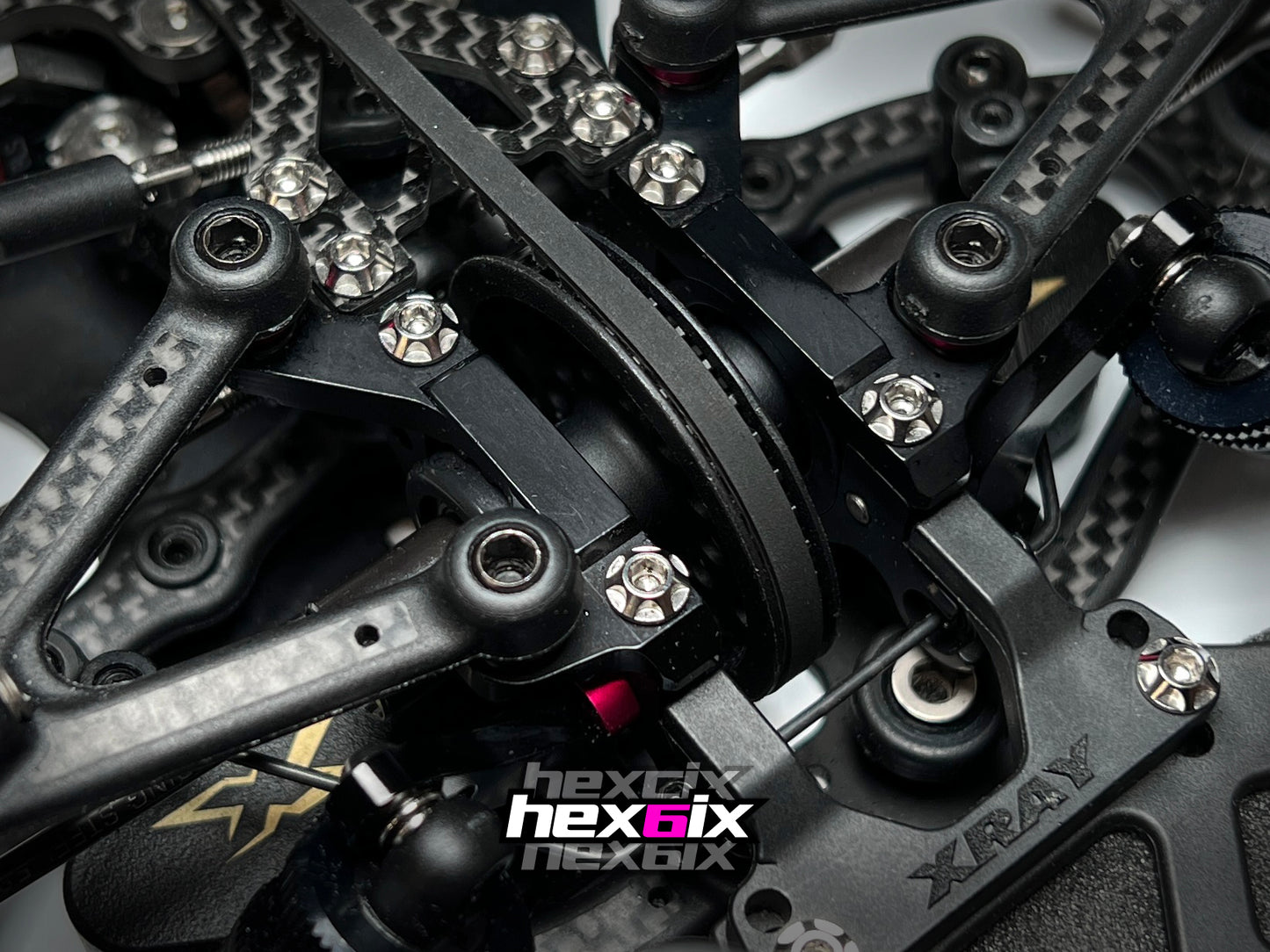 Hexcix M3 titanium screws installed on RC car chassis, showcasing precision fit and aggressive styling