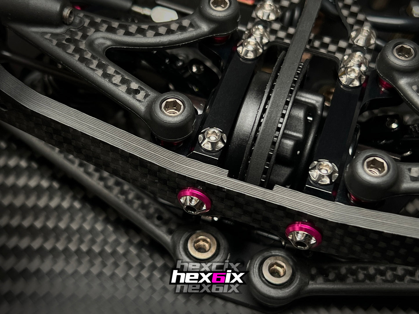 Hexcix M3 titanium screws installed on RC car chassis, showcasing precision fit and aggressive styling