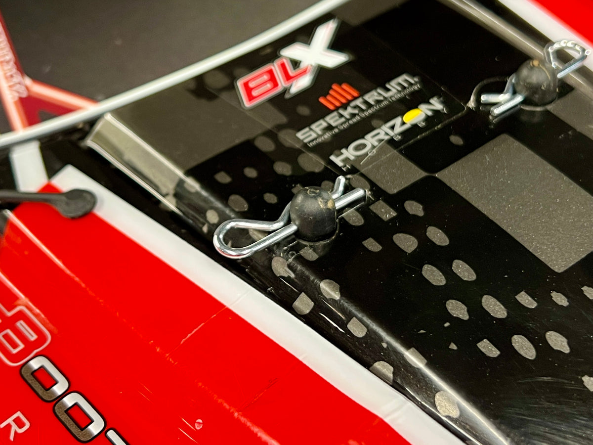 Large body clips shown installed on Arrma RC truck