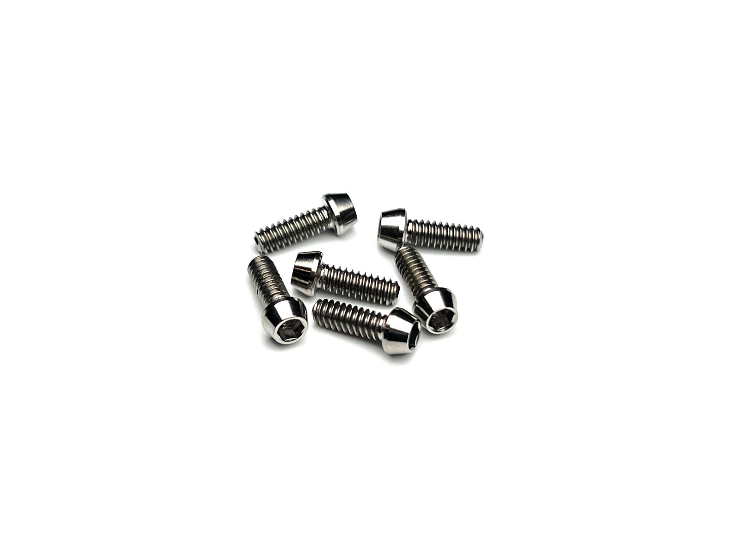 Close-up of Sortafast 4-40 titanium pan car rear wheel screws (6-pack) on white background, ideal for 1/12 and 1/10 scale oval and on-road RC builds.