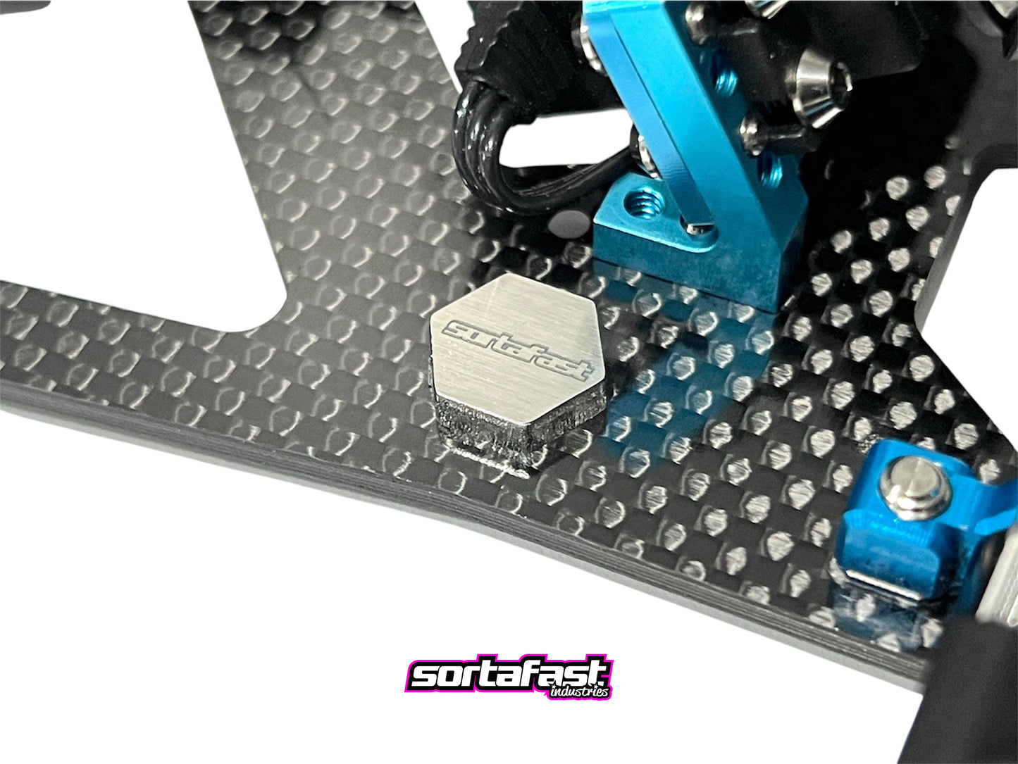 Sortafast Stainless Steel Chassis Weights – 2.5g (2pk) precision 3mm stainless steel RC weights, compact 11x12mm size. Shown installed on RC car chassis.