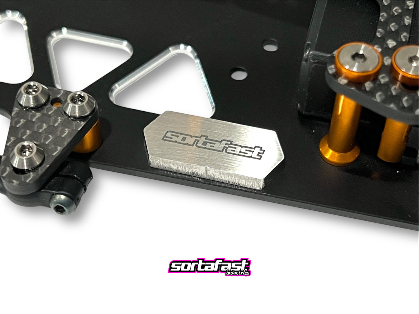 Sortafast Stainless Steel Chassis Weight – 5.5g precision-cut 3mm stainless steel weight for RC car balance tuning. Shown installed close up on RC car chassis.