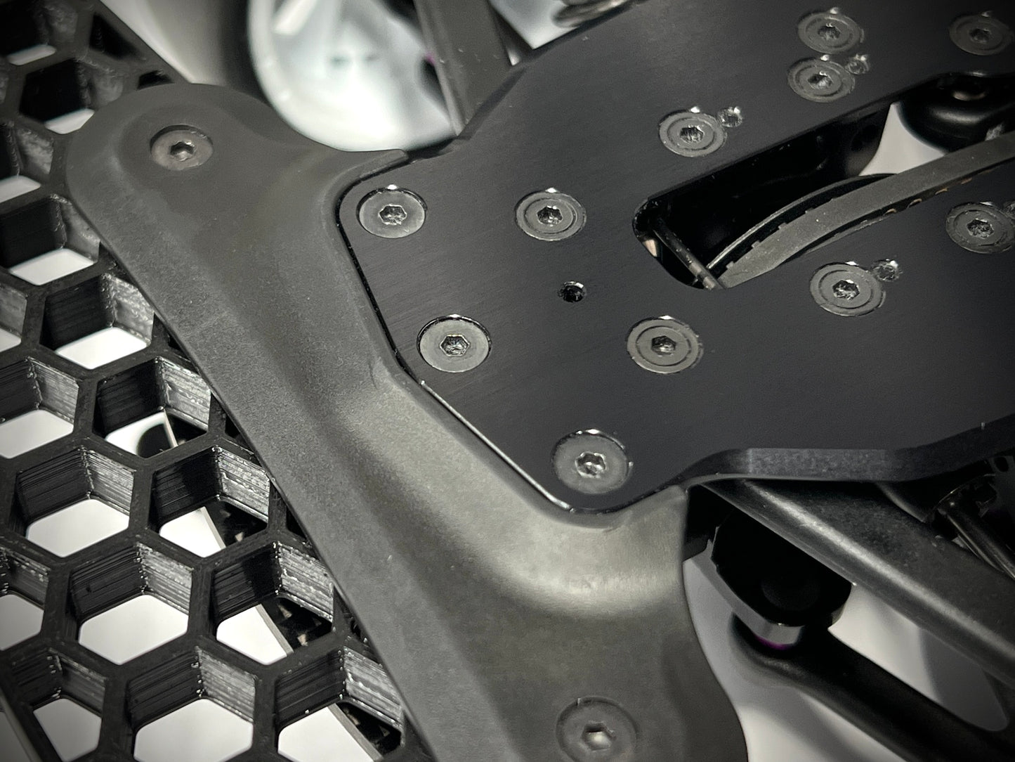 Bottom of XRAY X4 chassis, showing flush fit with Sortafast bumper shim installed.