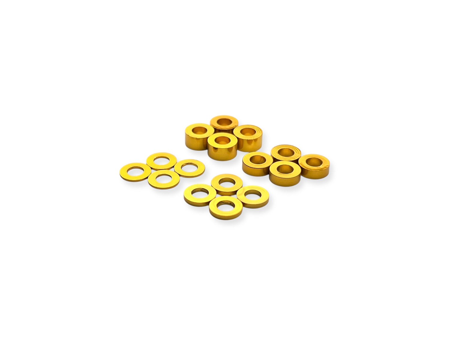 Sortafast 3x6mm aluminum shims in gold anodized finish, assorted thicknesses (0.5mm, 1mm, 2mm, 3mm), displayed on a white background – 16-piece pack.