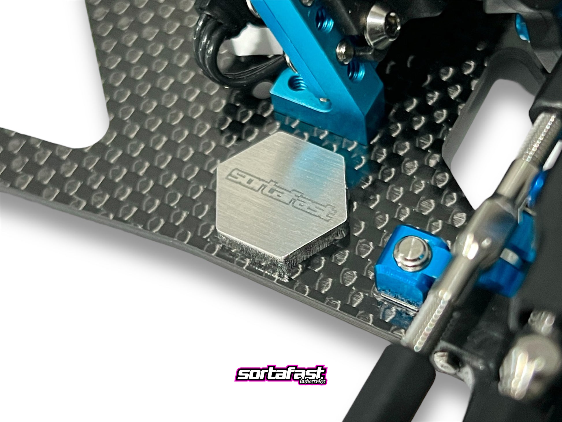 Sortafast Stainless Steel Chassis Weight – 4.5g precision-cut 3mm stainless steel weight for RC car balance and tuning. Close up shown installed on RC Car chassis.